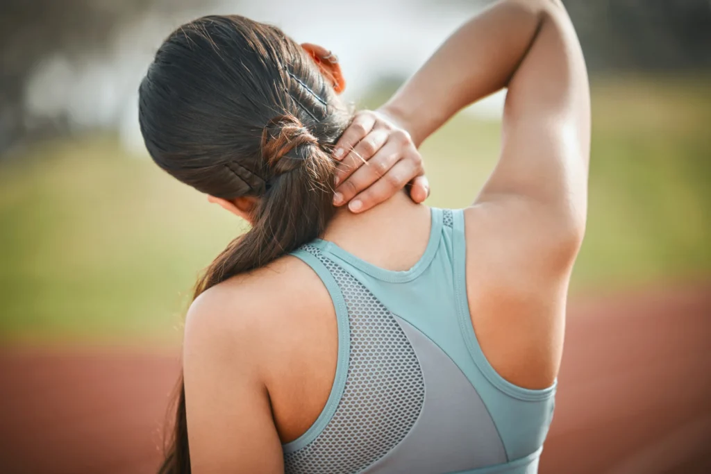 athletic woman stretching neck outdoors for wellne 2026 03 25 05 36 27 utc