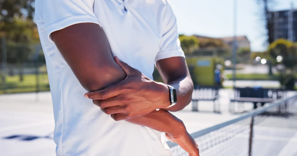 hands person and elbow pain on tennis court for f 2026 06 05 18 10 28 utc